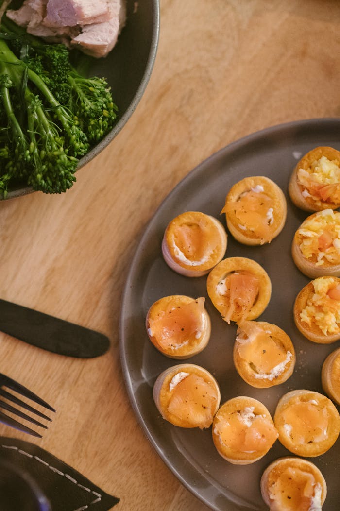 Elegant dinner table featuring smoked salmon bites and fresh broccoli.